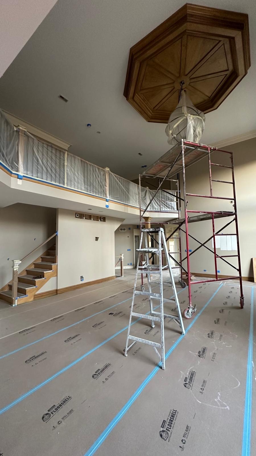 Bright two-story great room before and after painting